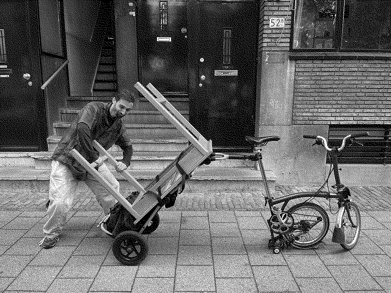 Elliott next to a bike trolley loaded with a small desk upside down behind a  folding bicycle